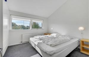 Postel nebo postele na pokoji v ubytování Apartment Nordre Strandvej I