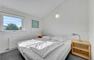 Postel nebo postele na pokoji v ubytování Apartment Nordre Strandvej I