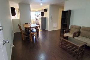 a living room and kitchen with a table and a couch at Departamento 3 D. Cochabamba in Cochabamba