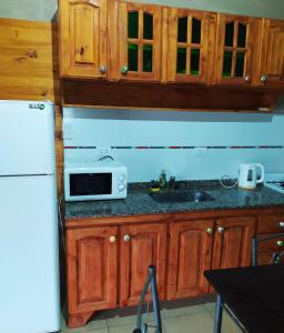 Una cocina o kitchenette en Cabañas Lomas de Calamuchita