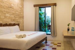 Ein Bett oder Betten in einem Zimmer der Unterkunft Hotel Boutique Casa Hipil