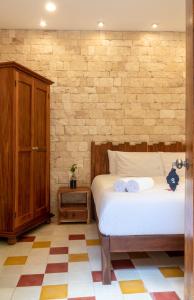 Ein Bett oder Betten in einem Zimmer der Unterkunft Hotel Boutique Casa Hipil