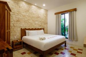 Ein Bett oder Betten in einem Zimmer der Unterkunft Hotel Boutique Casa Hipil