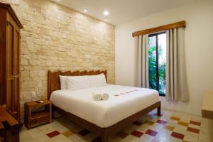 Ein Bett oder Betten in einem Zimmer der Unterkunft Hotel Boutique Casa Hipil