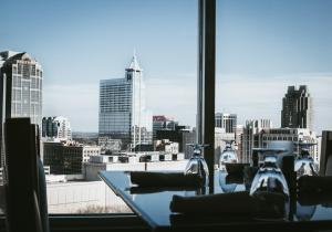 a table with a view of a city skyline at Holiday Inn Raleigh Downtown, an IHG Hotel in Raleigh