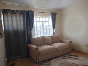 A seating area at Amazing 1 Bedroom Apartment, Juja