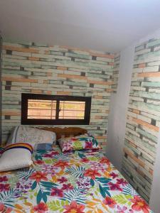 מיטה או מיטות בחדר ב-Rochelle Mendoza
