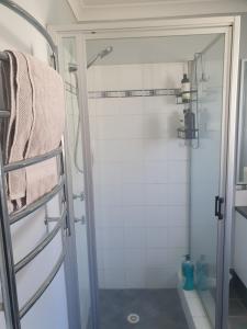 a shower with a glass door in a bathroom at Dalyellup Private Guest House unit in Bunbury