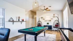 a living room with a pool table in it at 69th Glendale home in Glendale