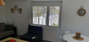Khu vực ghế ngồi tại Apartmani Hanna