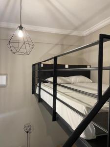 a bedroom with two bunk beds and a light at Kentrikon in Chalkida