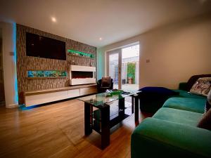 a living room with a couch and a coffee table at Sandpearl Suite Apartments in Lytham St Annes