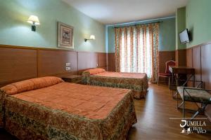 Postel nebo postele na pokoji v ubytování Hotel Pio XII Jumilla