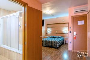 Postel nebo postele na pokoji v ubytování Hotel Pio XII Jumilla