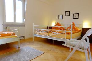a bedroom with two bunk beds and a window at heidel-home 3Raum Wohnung in Heidelberg