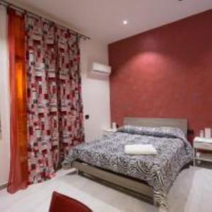 Posteľ alebo postele v izbe v ubytovaní MADB&B