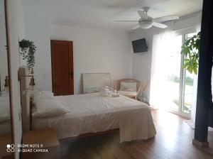 Postel nebo postele na pokoji v ubytování VILLA SANTA CLARA