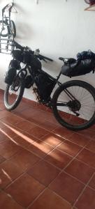 a bike parked against a wall in a room at Habitación Privada May in Vecindario