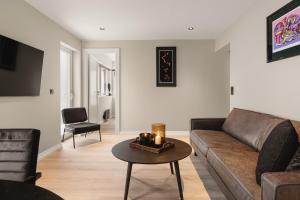 a living room with a couch and a table at Odda View - 4BR & 2BR & 1BR - B11 in Odda
