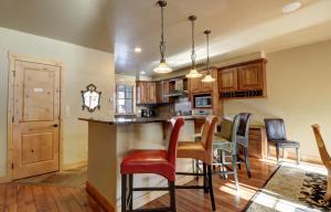 a kitchen and dining room with a table and chairs at 39B Union Creek Townhomes West in Copper Mountain