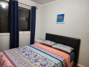 Postel nebo postele na pokoji v ubytování Homestay near Dandenong Plaza + 8 fotografií