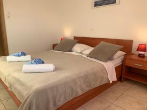 Postel nebo postele na pokoji v ubytování Apartments Julija