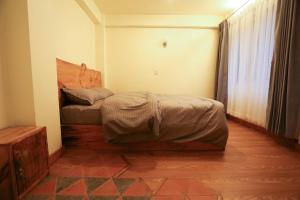 Katil atau katil-katil dalam bilik di Lumwoh Guest House