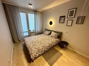 Postel nebo postele na pokoji v ubytování Liepu Apartments Druskininkai