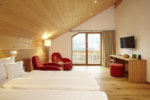 TV a/nebo společenská místnost v ubytování Bio-Hotel Oswalda-Hus