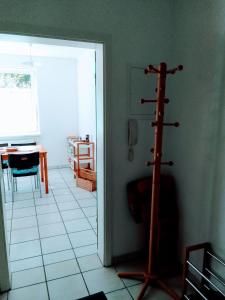 a room with a room with a living room with a pole in it at Wohnung im Park in Thulendorf