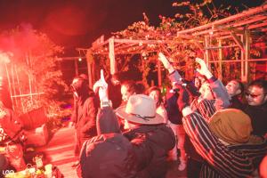 a group of people raising their hands in the air at Lan Ha Floating Homestay in Cat Ba