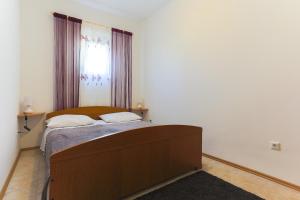 Ένα ή περισσότερα κρεβάτια σε δωμάτιο στο Apartment Ema