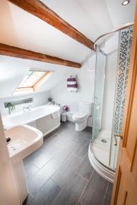 a bathroom with a sink toilet and a shower at Luxury Studio Apartment - Town Centre in Whitehaven