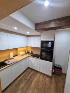 Kuchyň nebo kuchyňský kout v ubytování Apartament na krzywym
