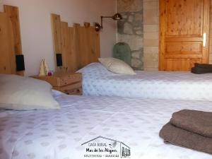 Postel nebo postele na pokoji v ubytování Casa Rural Mas de les Àligues