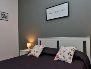 A bed or beds in a room at Amaryllis Apartments