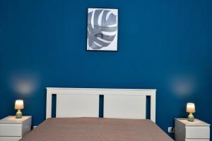 A bed or beds in a room at Amaryllis Apartments