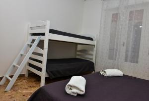 A bed or beds in a room at Amaryllis Apartments