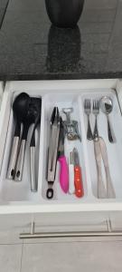 a drawer filled with utensils on a kitchen counter at Marielitsa Guest Suite No 3 in Germiston