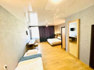 Ένα ή περισσότερα κρεβάτια σε δωμάτιο στο Green Hotel ANG