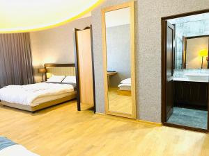 Ένα ή περισσότερα κρεβάτια σε δωμάτιο στο Green Hotel ANG