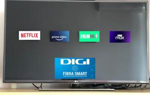 a television screen with different signs on a wall at Apartamento Las Chumberas in Roquetas de Mar