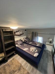 a bedroom with a bed and a book shelf at Real Deal Apartment in Budapest