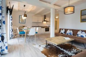 a living room with a couch and a table at Villa Bellevue 3 _App_ 12 in Ahlbeck