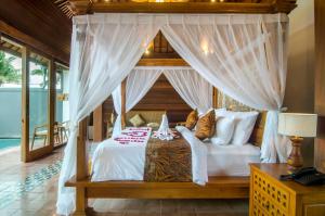 Postel nebo postele na pokoji v ubytování Danakha Villa Ubud