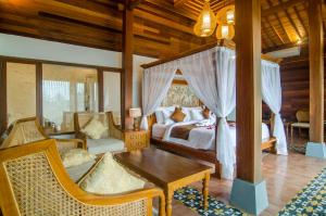 Postel nebo postele na pokoji v ubytování Danakha Villa Ubud + 37 fotografií