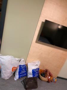 a room with two bags of food on the floor at Rooms Kokhta Mitarbi apartments in Bakuriani