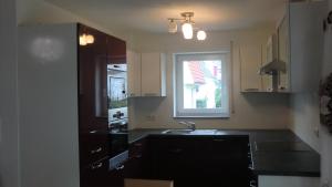 a kitchen with a sink and a window at Diana in Lahr