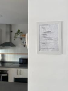 a picture hanging on a wall in a kitchen at Apartamento ANY in Benaoján +23 photos