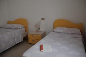 A bed or beds in a room at Appartamento Maestrale